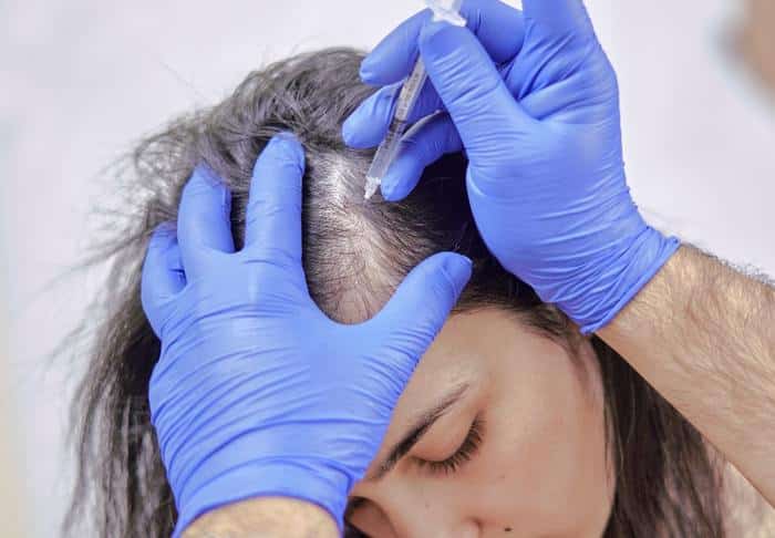 woman restoring her hair with injections